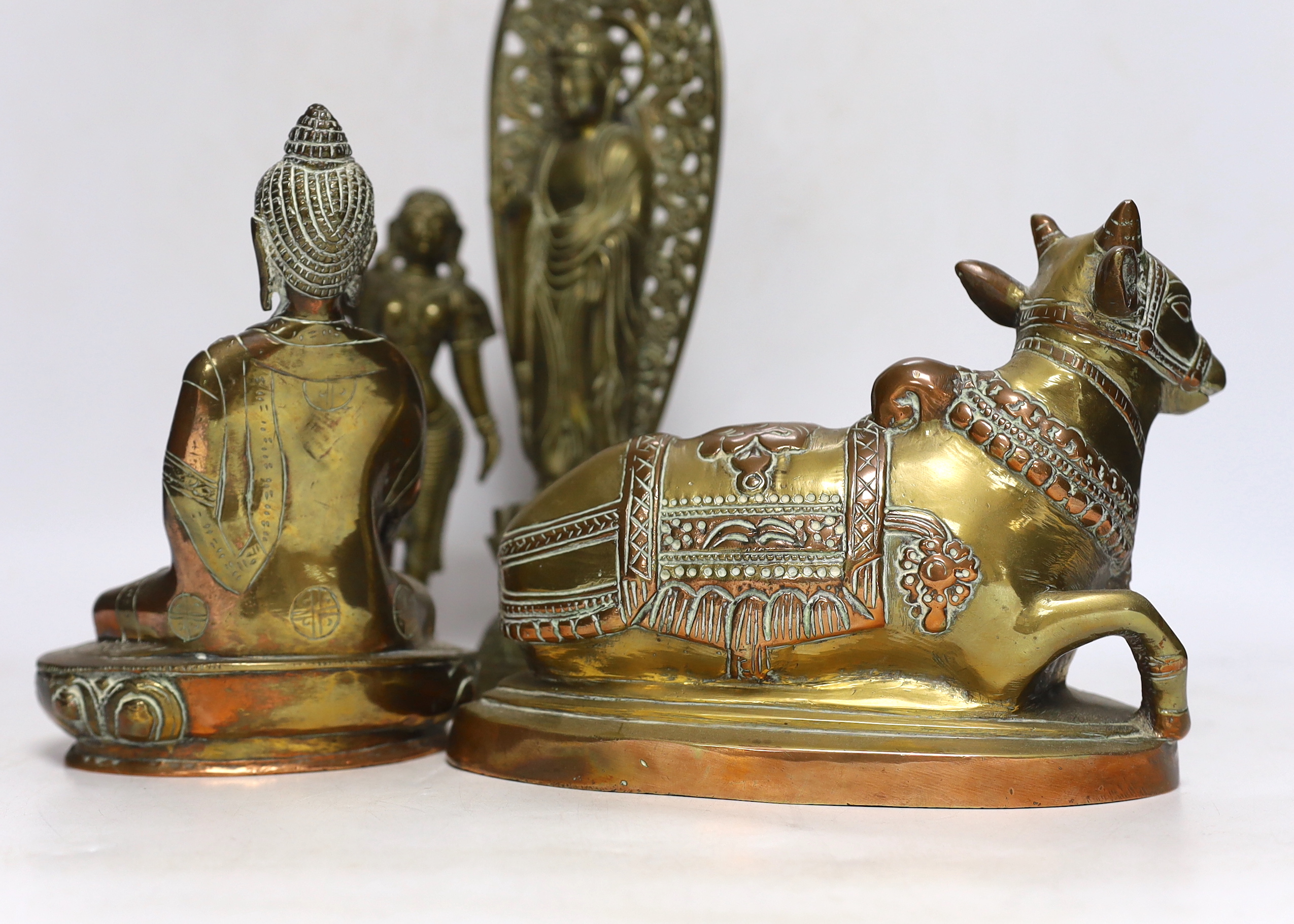 Four bronze deities and a Chinese copper pedestal bowl, tallest 29cm